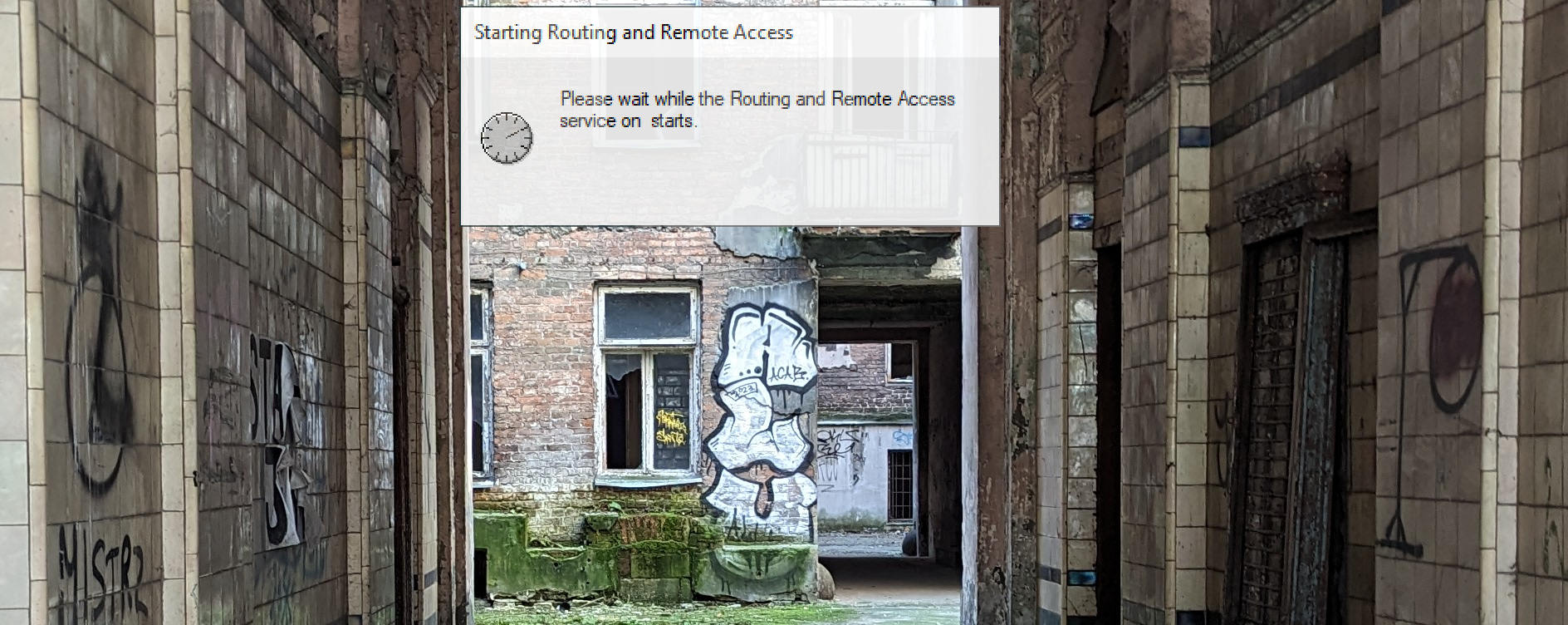 A abandoned back ally, overalid is windows window saysing "starting RRAS"